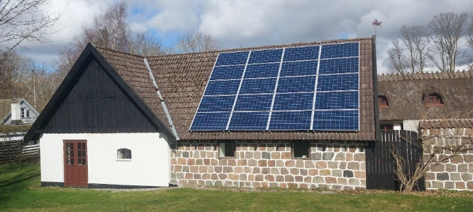 a house with a solar panel on the roof